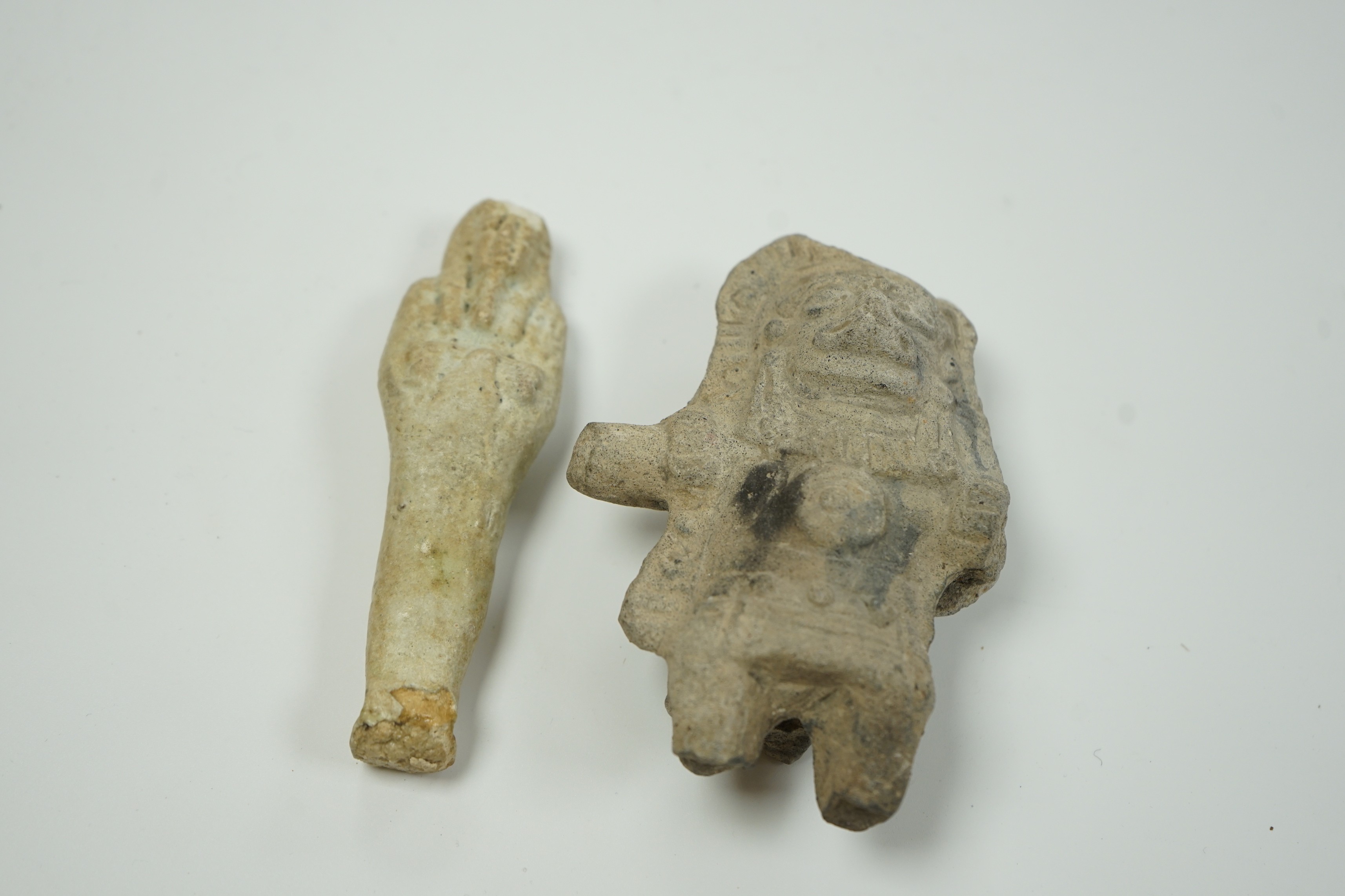 An Egyptian cream faience ushabti and a pre-Columbian pottery figure, 10cm high